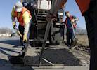 Road repair spending boosts May Gurney image