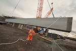 106 tonne concrete bridge beam lifted into place on Mersey Gateway project image