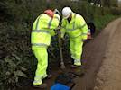 Volunteers carrying out pothole repairs in Devon image