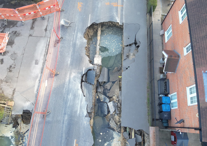 Huge sinkhole appears in Surrey high street